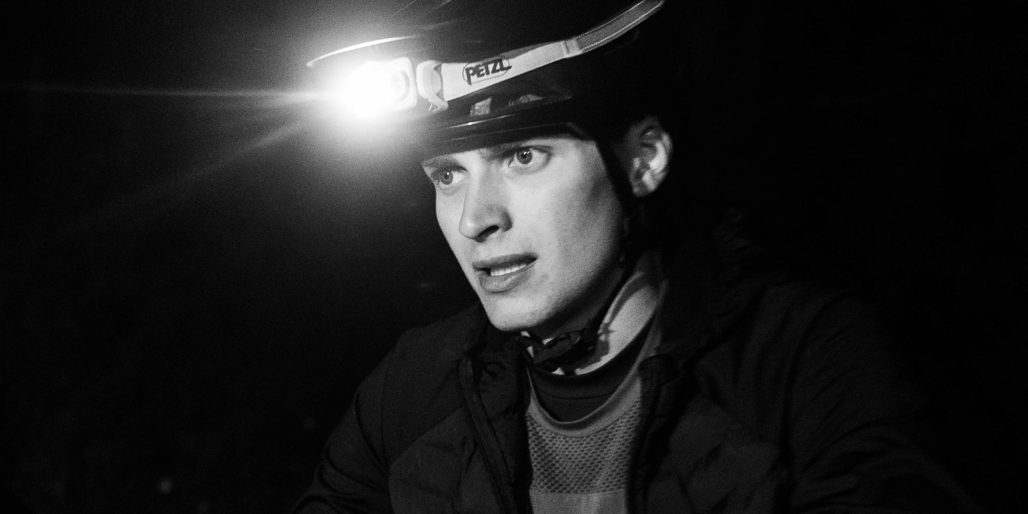 Jules wears a headlamp in the dark.