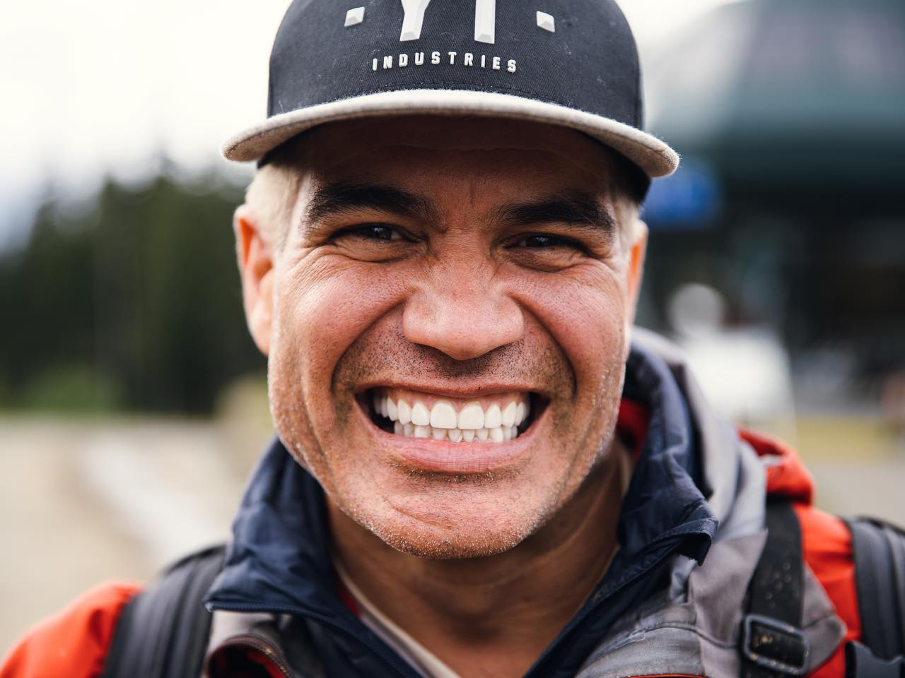 Portrait of Brett Tippie wearing a cap and smiling broadly.