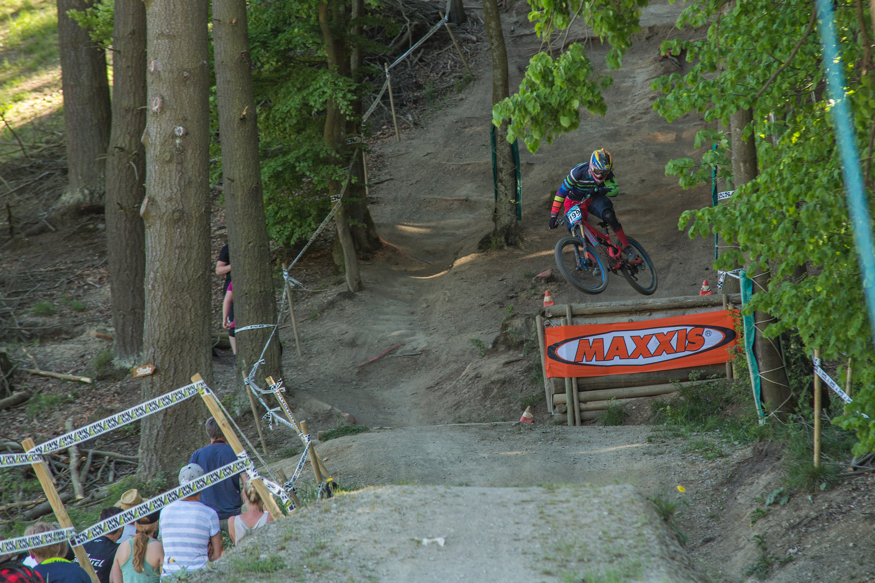 Bikepark Winterberg. Rider riding downhill on a trail.