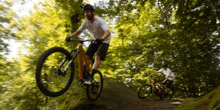 Mountain biker in the forest on a new Ergon SMS saddle.