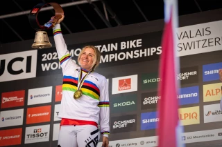 Vali Höll on the podium at the world championships wearing a gold medal