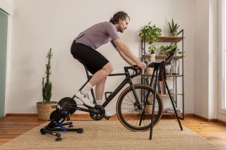 Indoor Cycling Man Man sitting on indoor cycling bike.