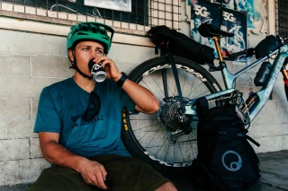 Fairbrother-Samoa-Break Matthew Fairbrother leaning against a wall while drinking something.